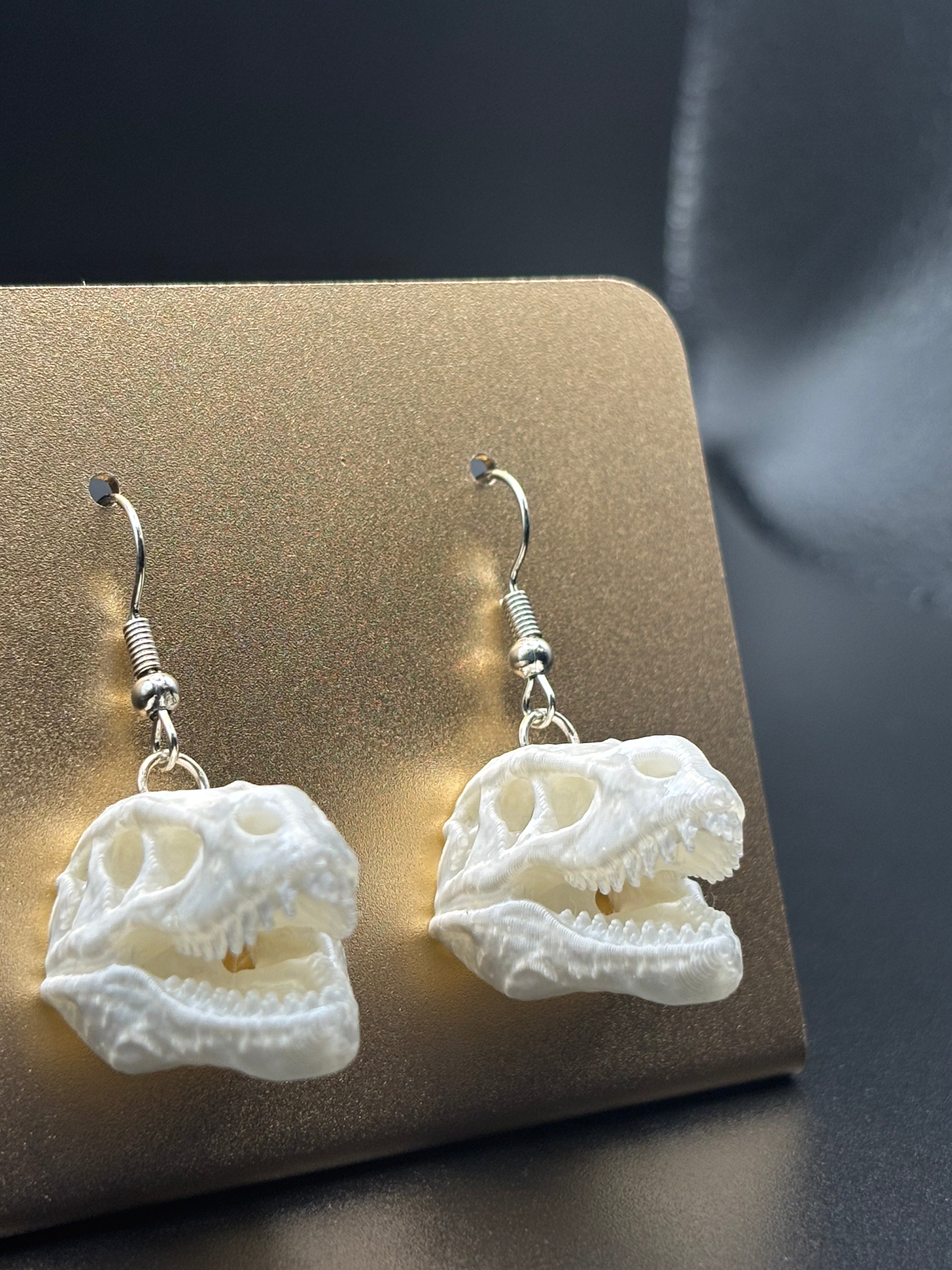 T Rex skull earrings